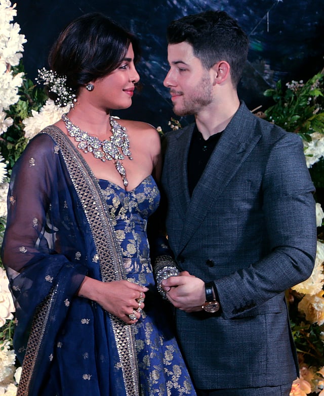 Bollywood actress Priyanka Chopra and musician Nick Jonas pose for photographs at their wedding reception in Mumbai, India, Wednesday, 19 December 2018. Photo: AP