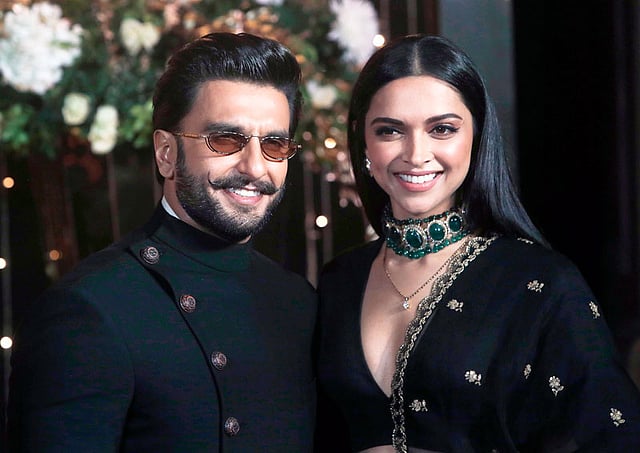Bollywood actors Deepika Padukone, right, and Ranveer Singh stand for photographs at Priyanka Chopra and musician Nick Jonas wedding reception in Mumbai, India, Thursday, 20 December 2018. Photo: AP