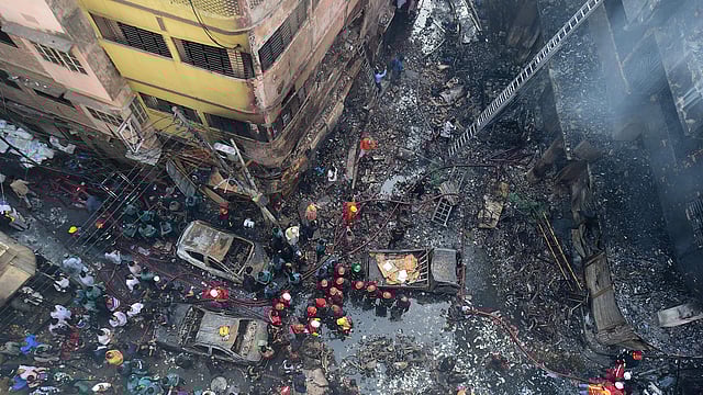 Firefighters are seen at the scene of a fire in Dhaka on 21 February 2019. Photo: AFP