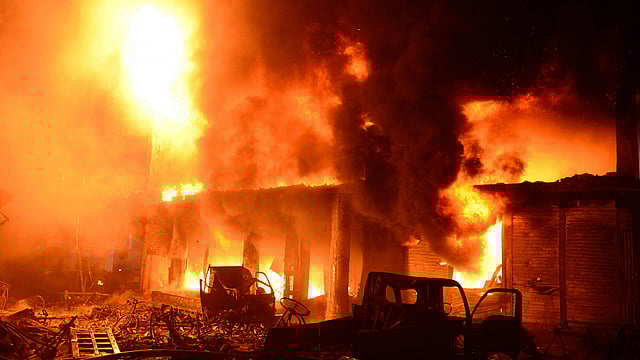 Flames and smoke rise from building after a fire broke out in an old part of the Bangladeshi capital Dhaka on 21 February 2019. Photo: AFP