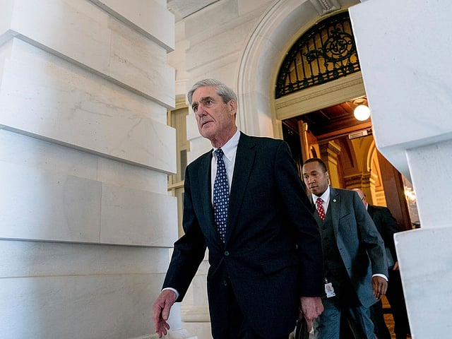 In this 21 June 2017 file photo, former FBI director Robert Mueller, the special counsel probing Russian interference in the 2016 election, departs Capitol Hill following a closed door meeting in Washington. AP File Photo