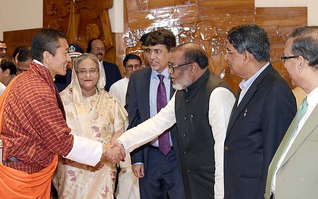 Prime minister Sheikh Hasina introduces Bhutanese prime minister Lotay Tshering (L) with cabinet members at Hazrat Shahjalal International Airport, Dhaka on 12 April. Photo: PID
