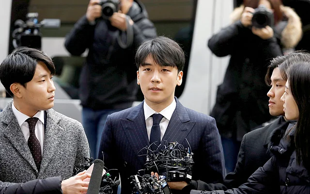 Seungri, a member of South Korean K-pop band Big Bang, arrives to be questioned over a sex bribery case at the Seoul Metropolitan Police Agency in Seoul, South Korea on 14 March. Photo: Reuters
