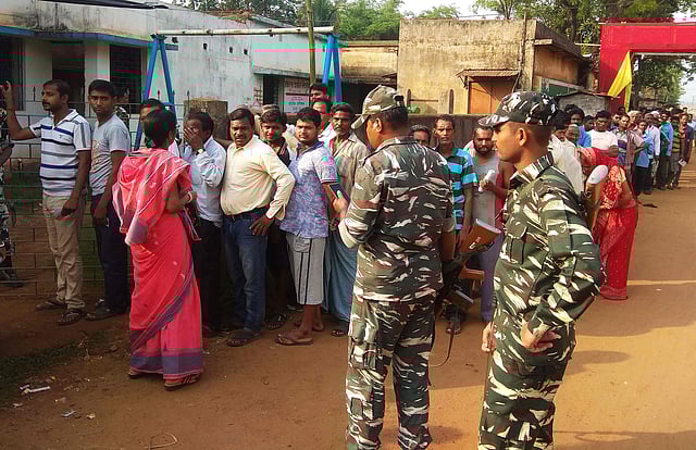 Voters queue up at a polling station to cast their ballots during the sixth phase of India`s general election in Jhargram in West Bengal state on 12 May 2019. Photo: AFP