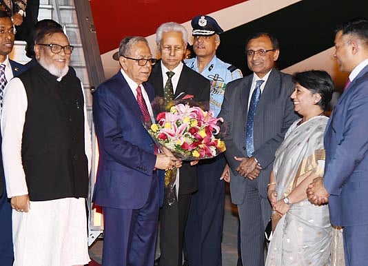 Bangladesh high commissioner to India Syed Moazzem Ali and his counterpart in Bangladesh Riva Ganguli Das welcome president Abdul Hamid at Indira Gandhi International Airport on Wednesday. Photo: BSS