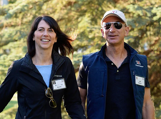 In this file photo taken on 12 July 2013, Mackenzie Bezos (L) and her husband Jeff Bezos, founder and CEO Amazon.com, arrive for the Allen & Co., arrives to the Allen & Co. annual conference in Sun Valley, Idaho, US. Photo: AFP