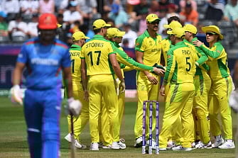 Australia`s Mitchell Starc (C) celebrates with teammates after dismissing Afghanistan`s Shahzad Mohammadi (L) for a duck during the 2019 Cricket World Cup group stage match between Afghanistan and Australia at Bristol County Ground in Bristol, southwest England, on 1 June 2019. Photo: AFP