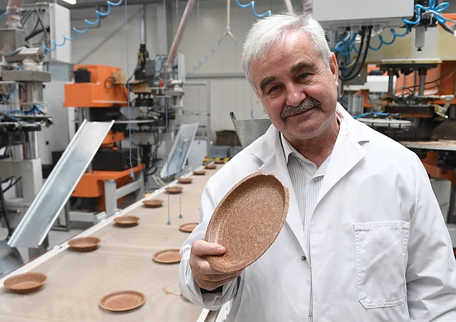Polish inventor and entrepreneur Jerzy Wysocki holds a wheat bran plate in his factory Biotrem in Zambrow, Poland, on 29 May 2019. Photo: AFP