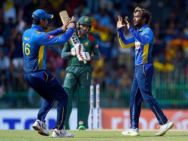 Akila Dananjaya removed Mohammad Mithun (in picture) and Mahmudullah in quick succession to rattle the Bangladesh batting. AFP