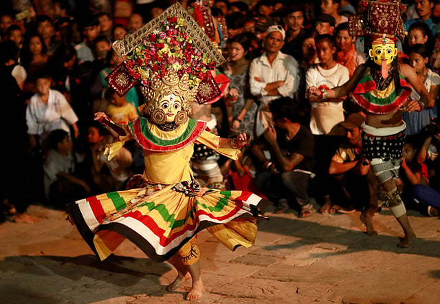 Masked dancers perform a traditional mask dance during the Indra Jatra Festival in Kathmandu, Nepal on 11 September 2019. Photo: Reuters
