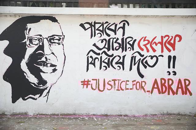 Graffiti reading `Can you bring back my son?` illustrates the grief-stricken face of Abrar`s father, Barkat Ullah