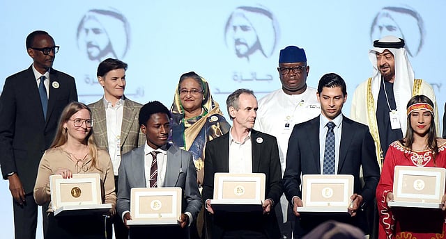 Prime minister Sheikh Hasina other leaders pose with the winners of Zayed Sustainability Prize at ICC Hall of Abu Dhabi National Exhibition on Monday. Photo: PID