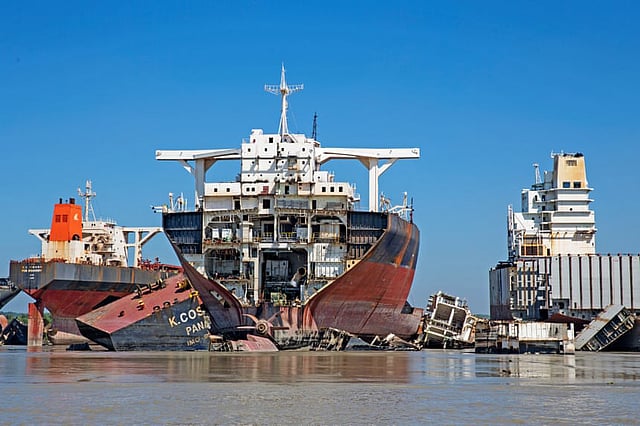 Labourers board the towering ships to strip them of anything re-saleable or reusable. Photo: The Guardian