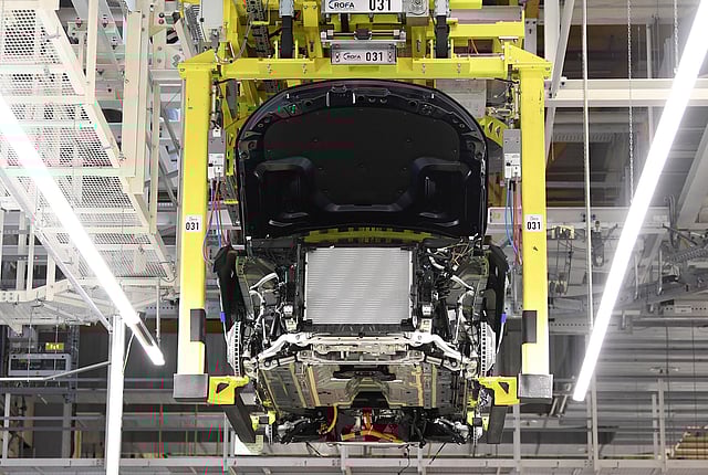 A battery cell is installed at a Mercedes-Benz EQC electric car in a production line at a plant in Bremen. Photo: Reuters