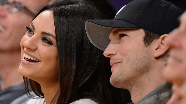 মিলা কুনিস ও অ্যাস্টন কুচার। ছবি: এএফপি