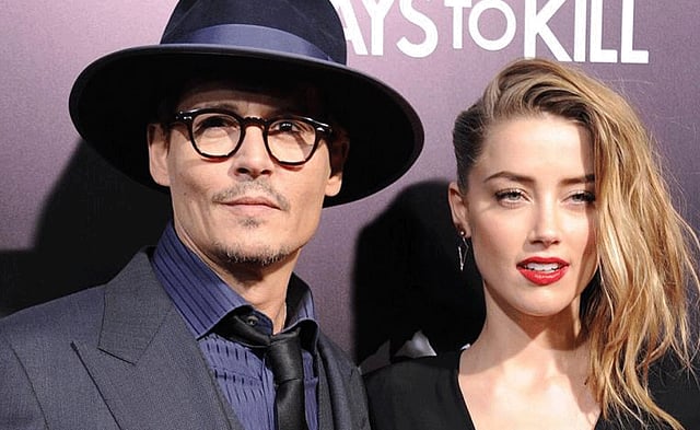 এক অনুষ্ঠানে জনি ডেপ ও অ্যাম্বার হেয়ার্ড। ছবি: এএফপি