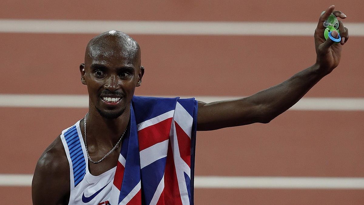 চোট নিয়েও ১০ হাজার মিটার দৌড়ে জিতলেন মো ফারাহ। ছবি: এএফপি