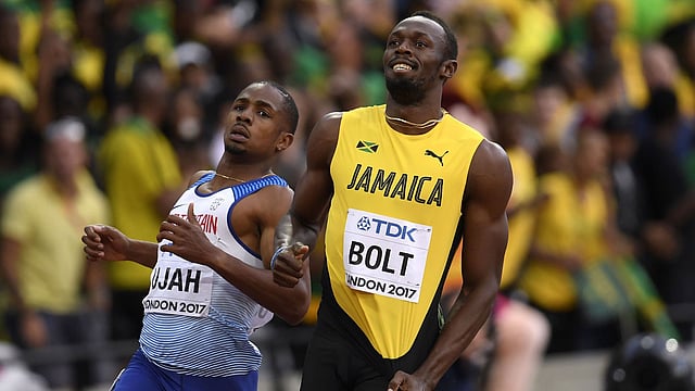 ফাইনাল নিশ্চিত করার পর বোল্টের হাসি। ছবি: রয়টার্স