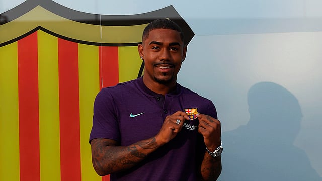 বার্সেলোনায় যোগ দিয়ে খুশি ম্যালকম। ছবি: এএফপি