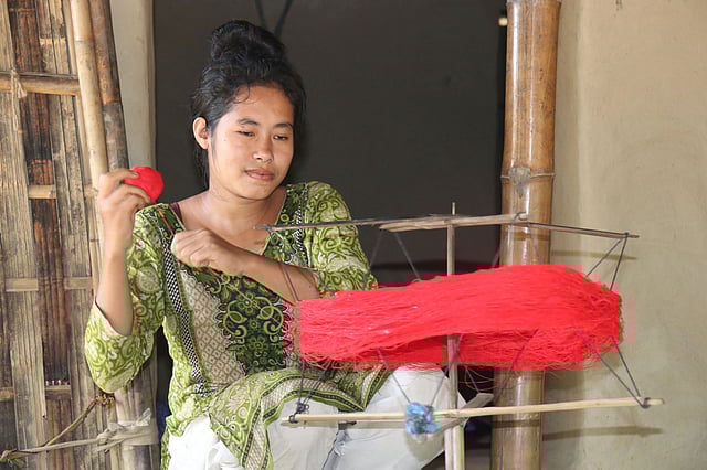 চরকায় সুতা কাটছেন ত্রিপুরা নারী। ছবিটি সম্প্রতি খাগড়াছড়ি সদরের পল্টন জয়পাড়া এলাকা থেকে তোলা। ছবি: নীরব চৌধুরী