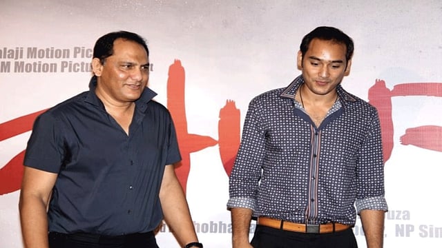 ছেলে আসাদের সঙ্গে আজহার। ফাইল ছবি
