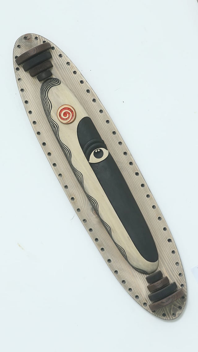 শিল্পী সজীব পলের কাঠের মুখোশ।