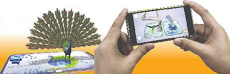 অগমেন্টেড রিয়ালিটি। বইয়ের সামনে মোবাইল ধরলেই ম–তে ময়ূর পেখম মেলছে।