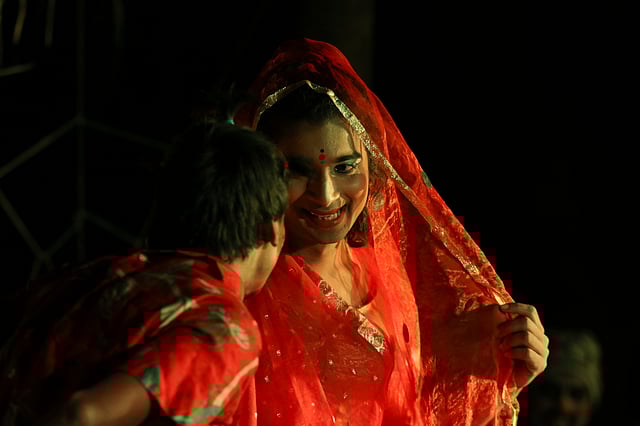 সন্ধ্যায় প্রদর্শিত হয় সং-নাটক। সেই নাটকের একটি দৃশ্য।