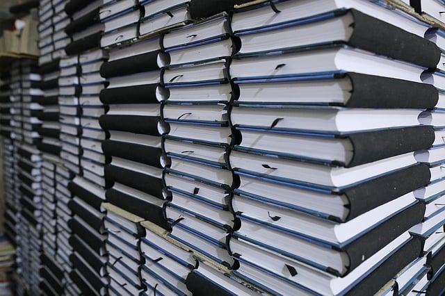 বাঁধাই শেষে মলাটের অপেক্ষায় শত শত বই।