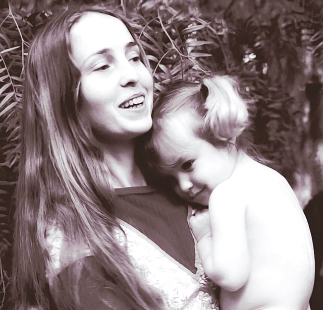 ব্রেনানের কোলে তাঁর মেয়ে লিসা ব্রেনান–জবস