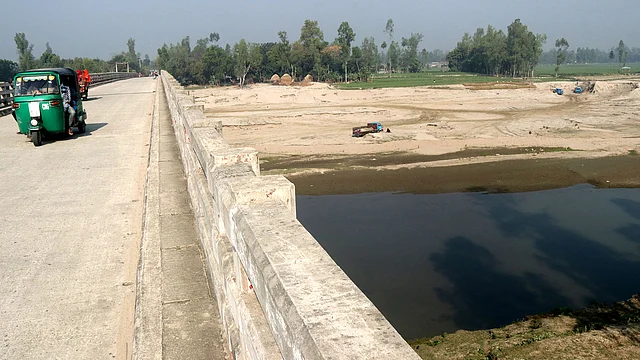 সেতু থেকে দেখা বিপন্ন বাঙ্গালী নদী।