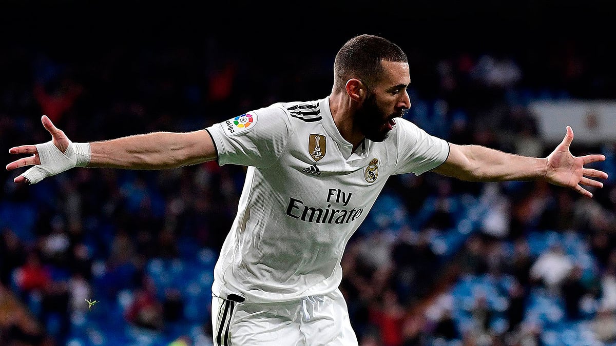 শেষ মুহূর্তে বেনজেমার গোলে জয় নিয়ে মাঠ ছাড়ে রিয়াল মাদ্রিদ। ছবি: এএফপি