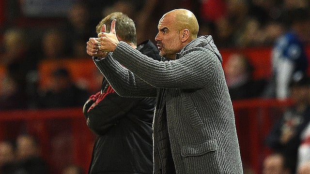 লিগ জয়ের সুবাস পাচ্ছেন সিটি কোচ পেপ গার্দিওলা। ছবি: এএফপি