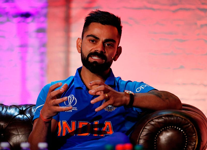 নরেন্দ মোদিকে শুভেচ্ছা জানালেন কোহলি। ছবি: এএফপি