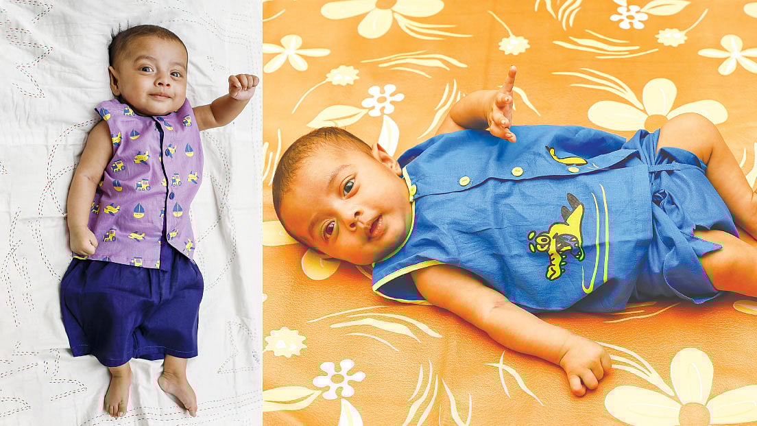 শিশুকে নতুন পোশাক পরানোর আগে ধুয়ে নিন। মডেল: নক্ষত্র, পোশাক: লা রিভ, ছবি: নকশা