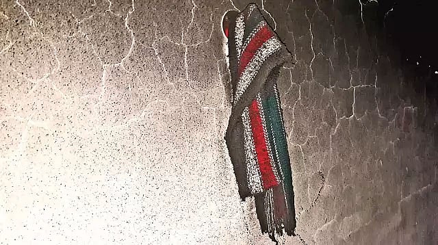 পুড়ে যাওয়া কারখানার দেয়ালে ঝুলছে নিহত শ্রমিক খালেকের মাফলার। প্রথম আলো ফাইল ছবি