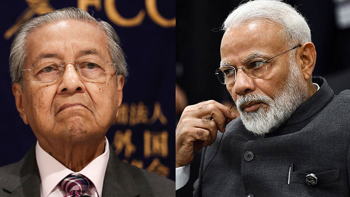 মালয়েশিয়ার প্রধানমন্ত্রী মাহাথির মোহাম্মদ ও ভারতের প্রধানমন্ত্রী নরেন্দ্র মোদি। ছবি: এএফপি
