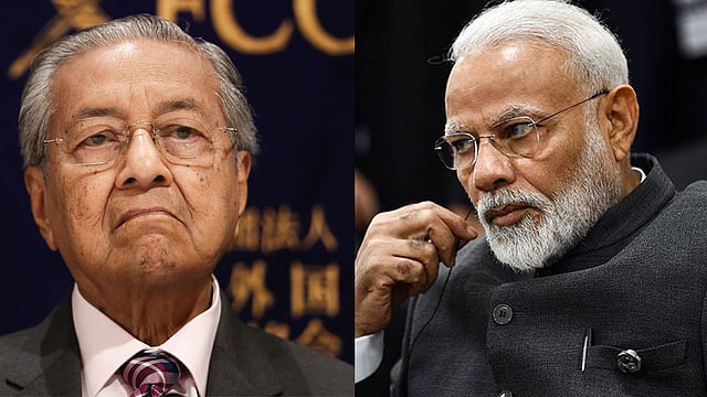 মালয়েশিয়ার প্রধানমন্ত্রী মাহাথির মোহাম্মদ ও ভারতের প্রধানমন্ত্রী নরেন্দ্র মোদি। ছবি: এএফপি