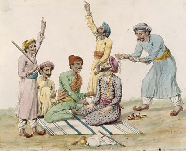 কয়েকজন ঠগি ভুলিয়ে রেখেছে পথচারীকে। একজন ঠগি তার পেছনে গামছার ফাঁস ঠিক করছে। উনিশ শতকে এক ভারতীয় শিল্পীর আঁকা ছবি। ছবি: উইকিপিডিয়া