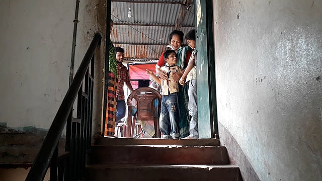 দরজায় মা ও ছেলে।