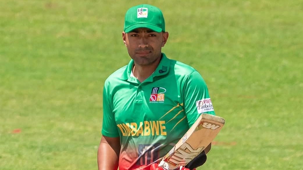জন্ম বেলজিয়ামে, বাবা পাকিস্তানি, মা ভারতীয়, বেড়ে উঠেছেন অস্ট্রেলিয়ায়, খেলবেন জিম্বাবুয়ের হয়ে