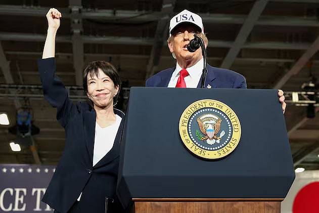 President Donald Trump and Japanese Prime Minister Sanae Takaichi on stage as they address U.S. troops aboard the USS George Washington during a visit to Japan. October 28, 2025, Yokosuka