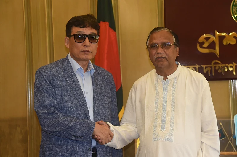 Dhaka South City Corporation Administrator Abdus Salam shakes hands with members of the Korean delegation at Nagar Bhaban. 12 March 2026