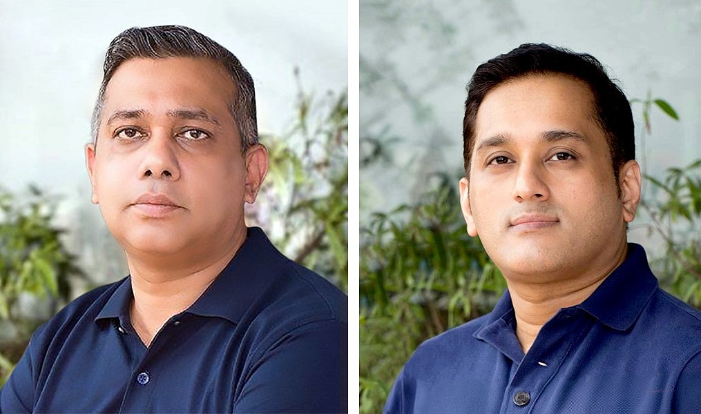 আমিনুল হাকিম ও আহমেদ জুনায়েদ (ডানে)