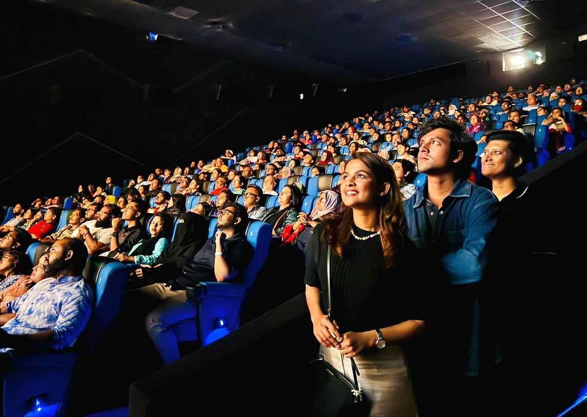 ‘উৎসব’ সিনেমা দর্শকদের সঙ্গে দেখছেন সাদিয়া ও সৌম্য জ্যোতিরা। ছবি: ফেসবুক থেকে