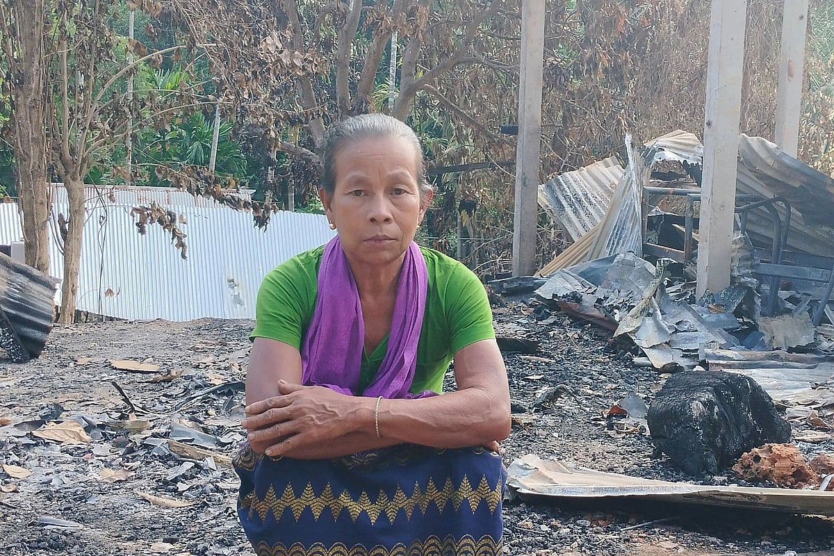 ধ্বংসস্তূপের পাশে বসে ছেলের স্মৃতি খুঁজে বেড়ান ক্রাসং মারমা। গত শনিবার খাগড়াছড়ির গুইমারার রামেসু বাজারে