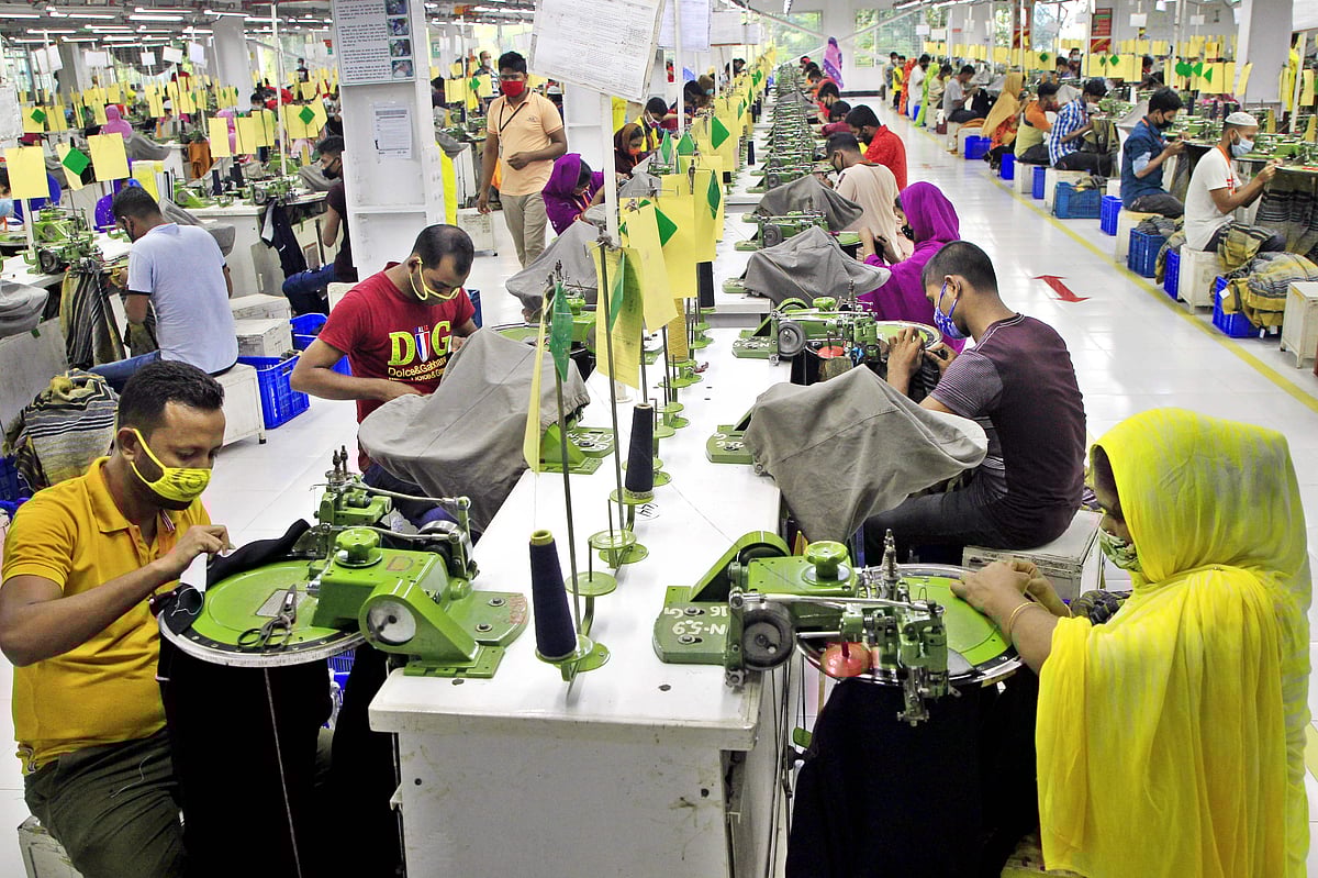 In this photograph taken on 29 August 2020, Bangladeshi labourers work in a garment factory in Gazipur