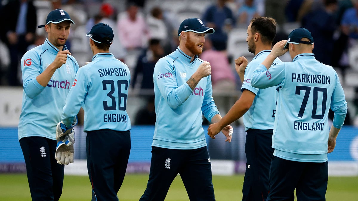 England's Ben Stokes (C) celebrates with England's Lewis Gregory (2nd R) as England players celebrate their victory in the second one day international (ODI) cricket match between England and Pakistan at Lord's cricket ground in London on 10 July, 2021