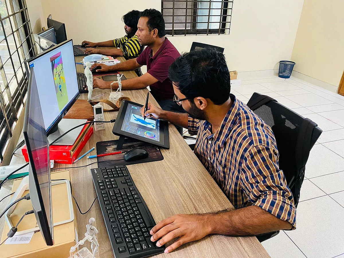 Game developers and designers work at Hamba Studio Hamaba