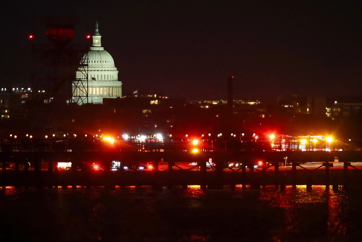 Emergency response units assemble on the tarmac as search and rescue operations are underway in the Potomac River at Ronald Reagan Washington Airport on January 29, 2025 in Arlington, Virginia